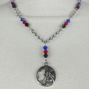 Fantasy dragon necklace with black, red, and blue faceted glass beads